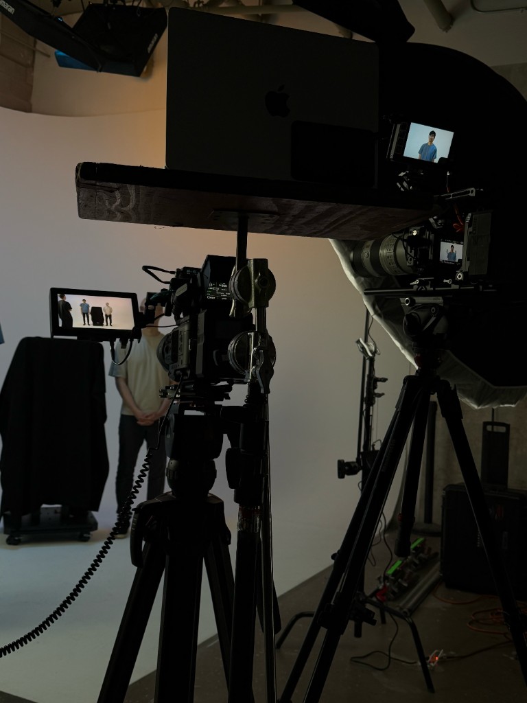 Two-camera setup for the founder interview and product reveal on a white cyclorama